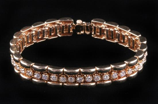 Appraisal: K YELLOW GOLD AND DIAMOND BRACELET Brick style links centered