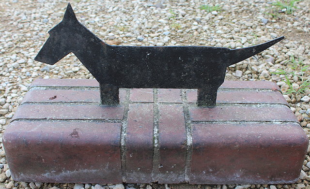 Appraisal: A CAST IRON BOOT SCRAPER in the form of a