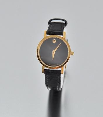 Appraisal: A Ladies' Movado Watch Round gold plated case black dial