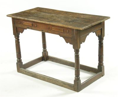 Appraisal: An th century oak side table the boarded top above