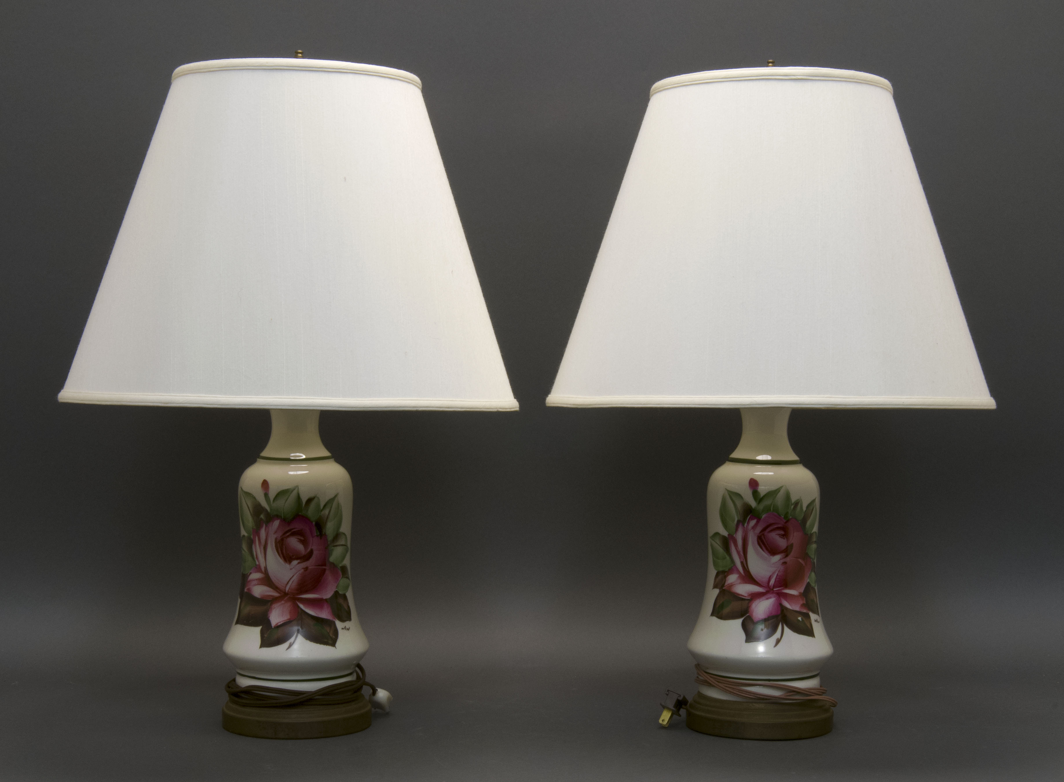 Appraisal: PAIR OF POTTERY TABLE LAMPS ContemporaryWith deep pink rose decoration