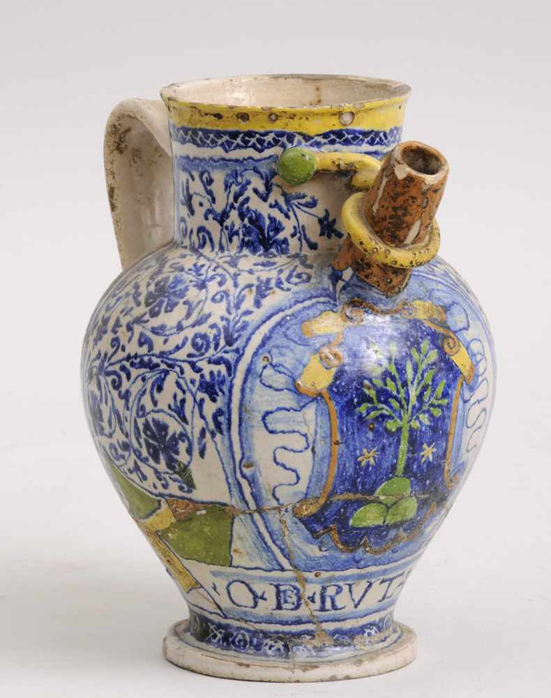 Appraisal: ITALIAN TIN-GLAZED EARTHENWARE PITCHER DERUTA The spout with looped rope