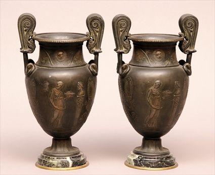 Appraisal: PAIR OF NEOCLASSICAL-STYLE PATINATED METAL AND MARBLE URNS Each amphora-form