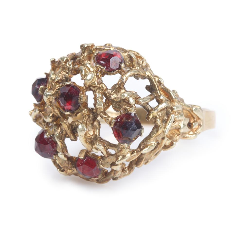 Appraisal: Vintage k yellow gold garnet openwork domed statement ring ring