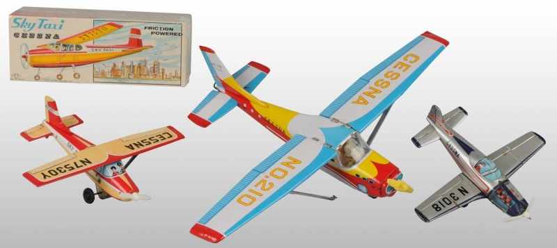 Appraisal: Lot of Tin Litho Cessna Airplane Friction Toys Description Japanese