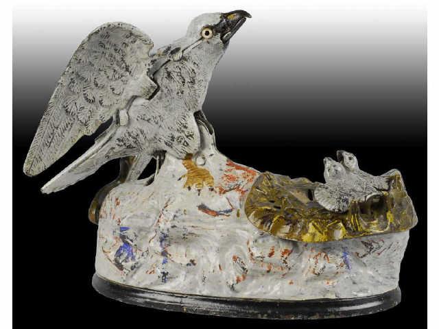 Appraisal: Cast Iron Eagle Eaglets Mechanical Bank Description J E Stevens