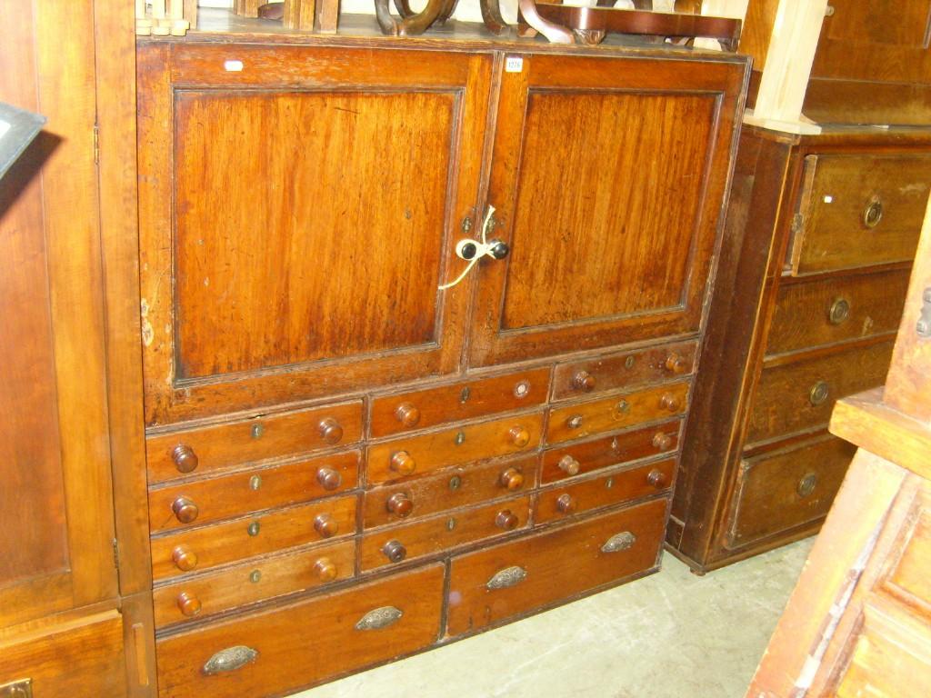 Appraisal: A Victorian mahogany and pine shop cabinet enclosed by a