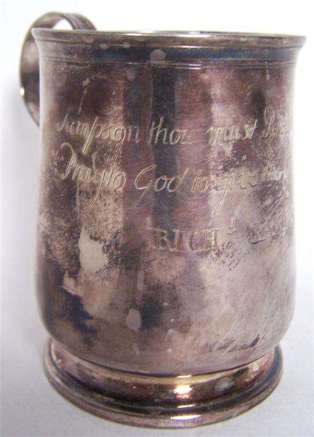 Appraisal: A George II mug Newcastle date letter struck twice makers