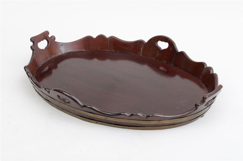 Appraisal: DUTCH BRASS-BANDED MAHOGANY TRAY The oval surface within scalloped gallery