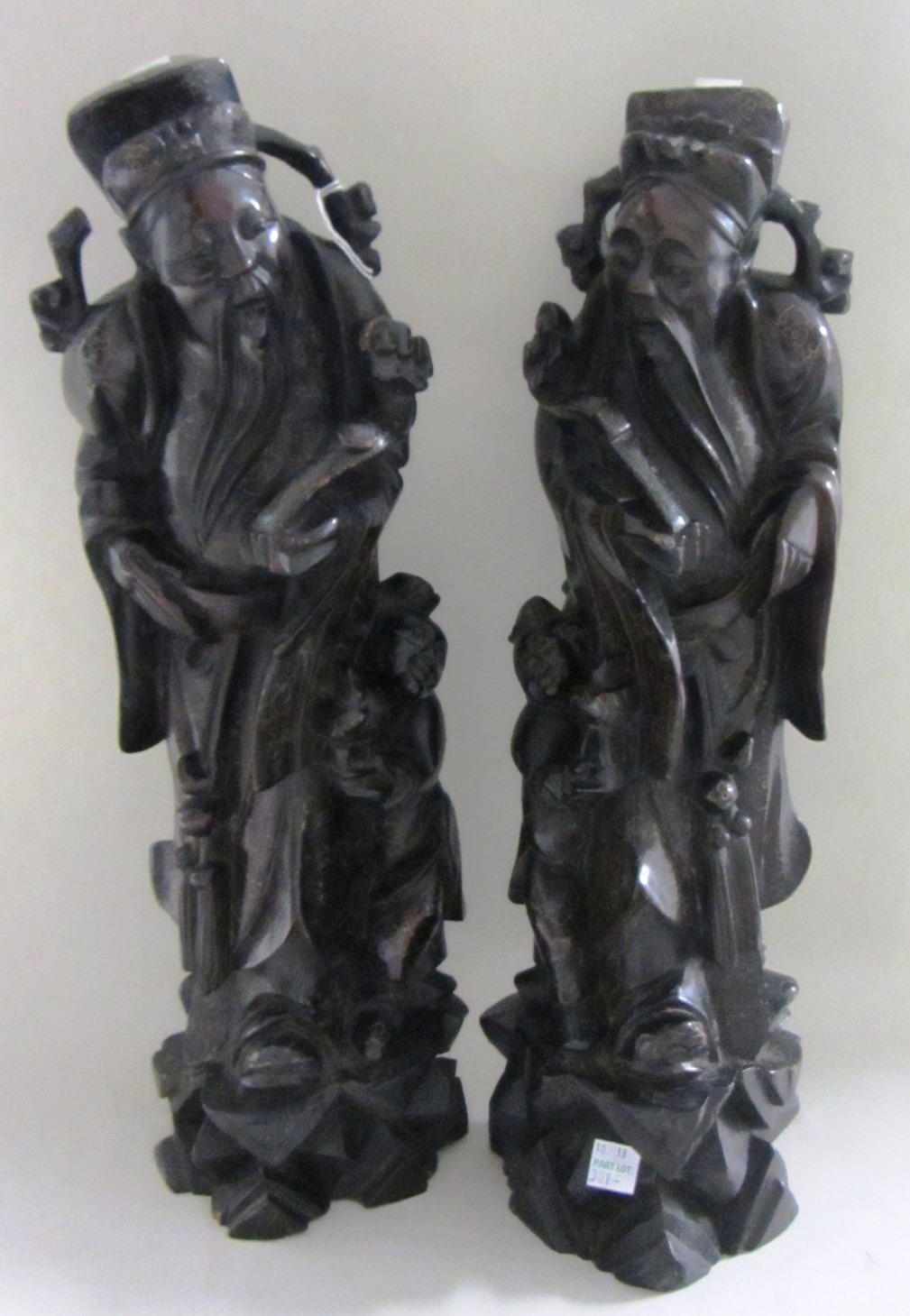 Appraisal: A pair of Chinese carved hardwood figures of sages late