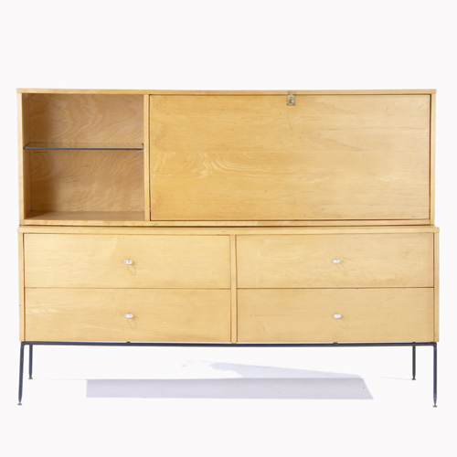 Appraisal: PAUL MCCOBB Cabinet with drop-down door enclosing two drawers over