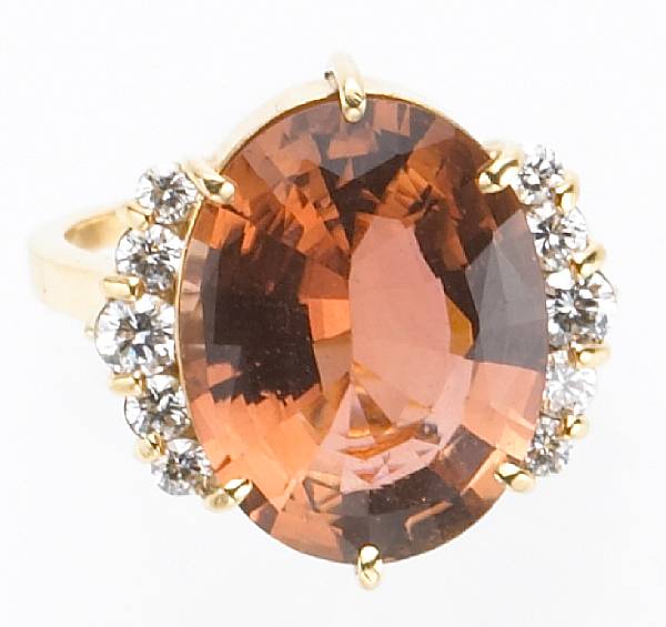 Appraisal: An pinkish-orange tourmaline and diamond ring tourmaline weighing an estimated