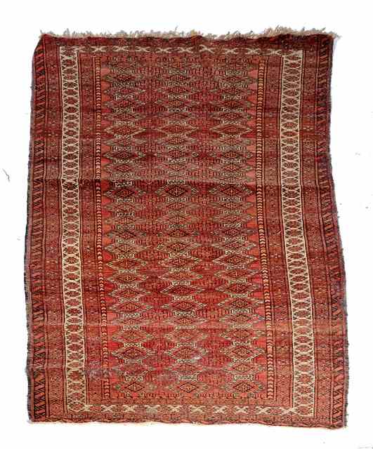 Appraisal: A BELOUCH WINE GROUND RUG decorated three rows of interlocked