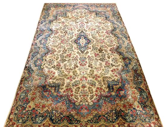 Appraisal: RUG Semi-Antique Persian Kirman carpet cream ground with overall floral