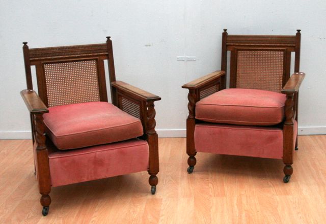 Appraisal: An Edwardian oak caned and upholstered lounge suite comprising of