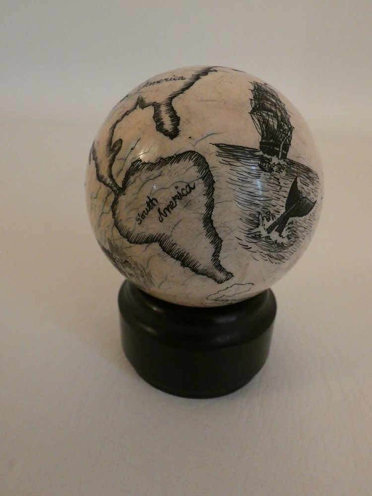 Appraisal: SCRIMSHAW GLOBE WHALING SCENES Antique billiard ball scrimshawed with globe