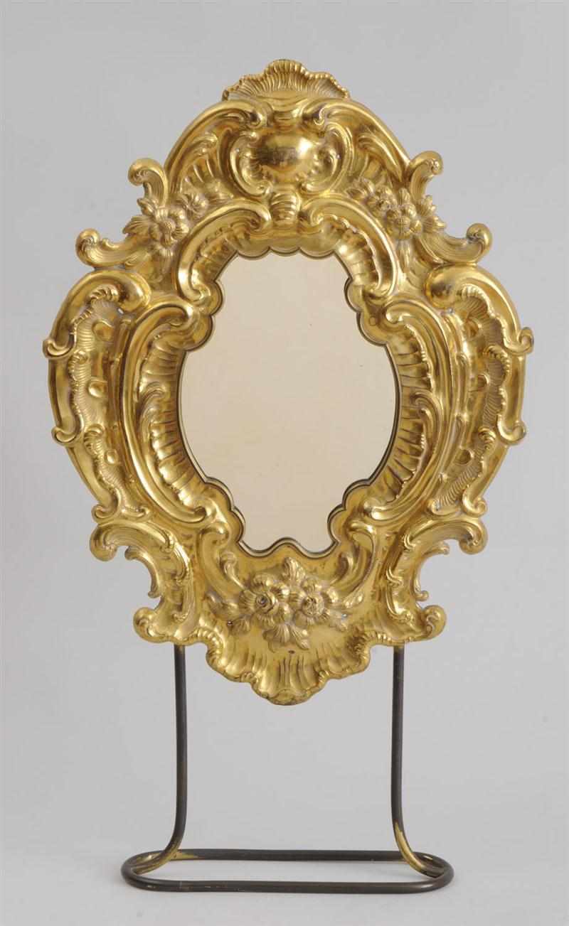 Appraisal: CONTINENTAL ROCOCO REPOUSS BRASS SMALL MIRROR The shaped plate within