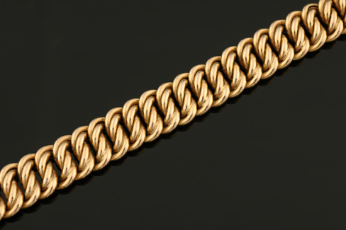 Appraisal: A gold bracelet Comprising double curblinks with engraved outer links