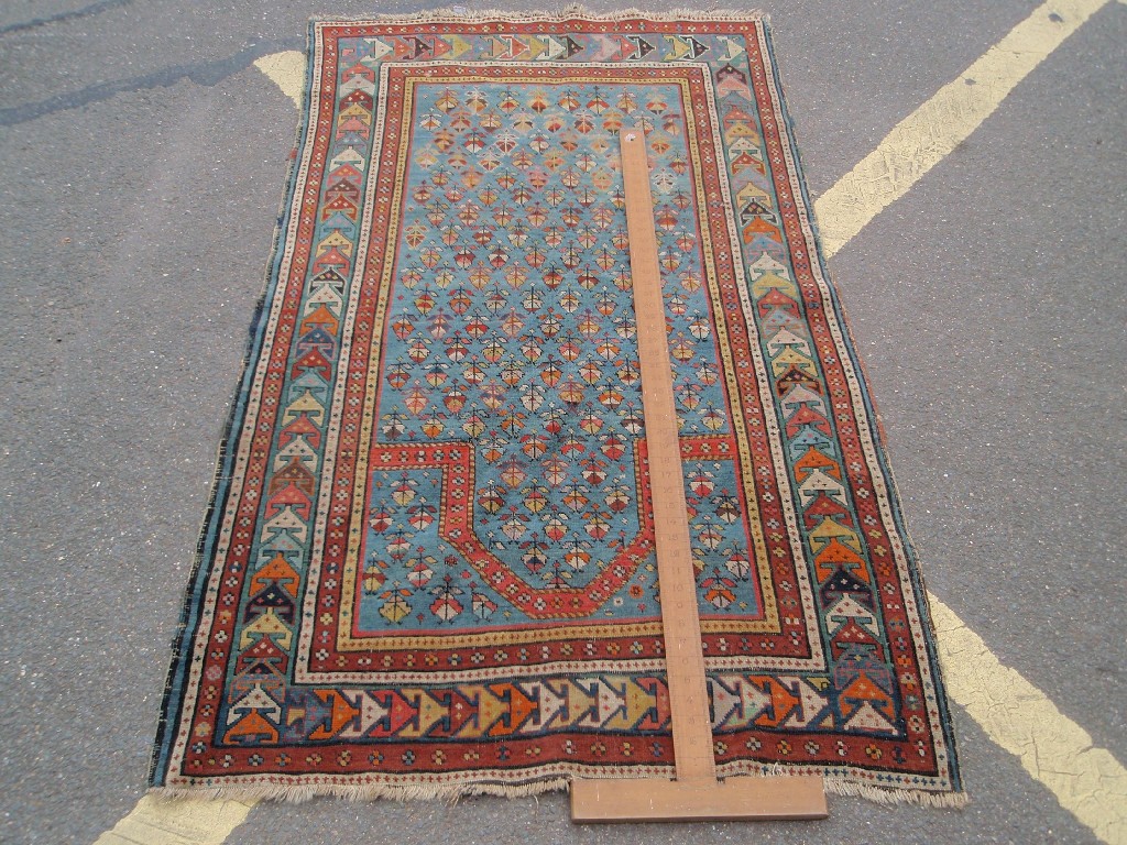 Appraisal: A Turkish design prayer rug with blue ground central multi-gull