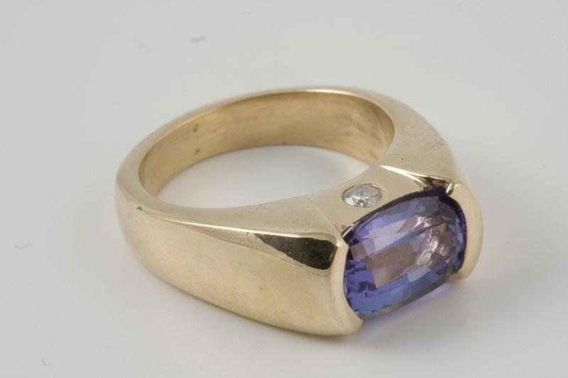 Appraisal: KT Yellow Gold Tanzanite Diamond Ring half bezel set oval