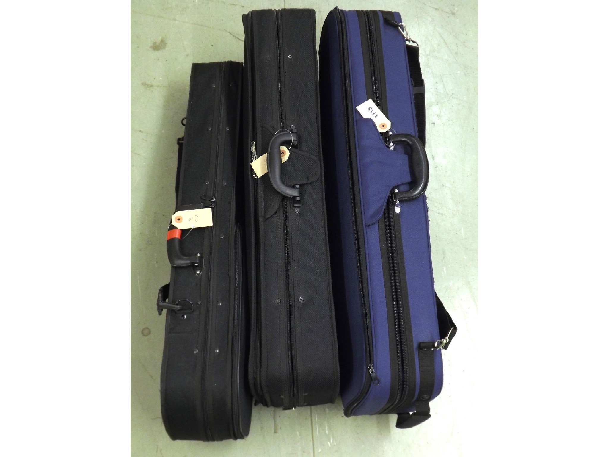 Appraisal: Three violin cases with outer zipper covers