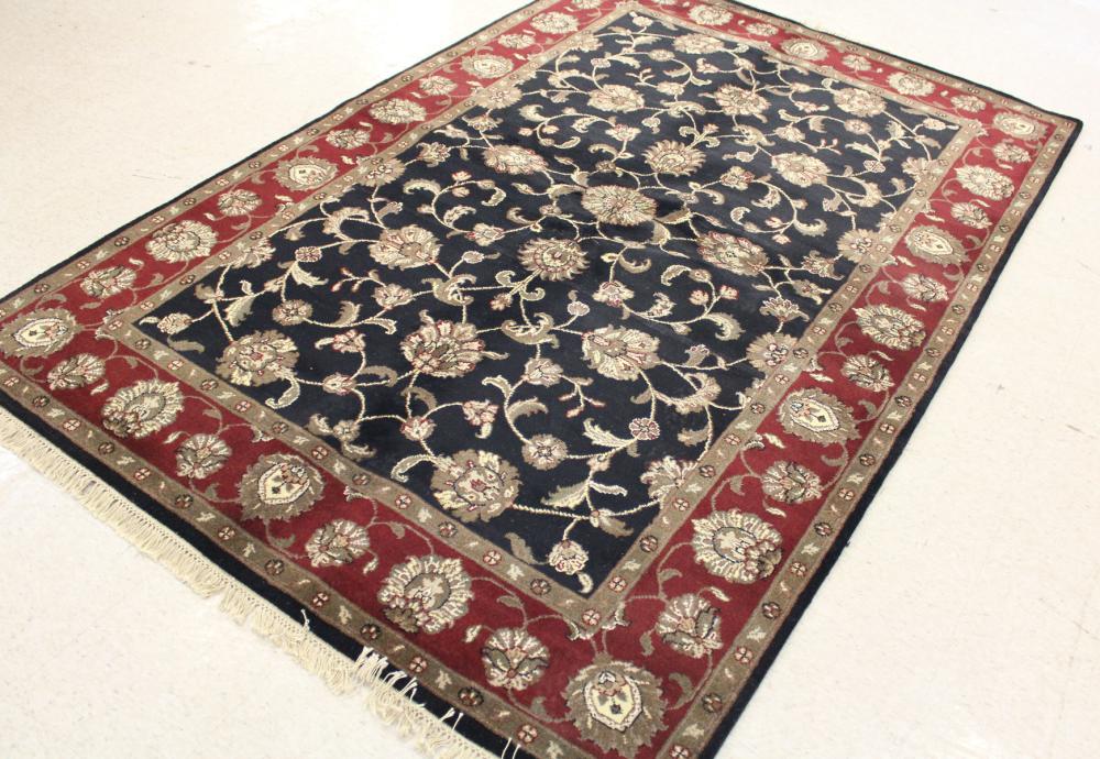 Appraisal: HAND KNOTTED ORIENTAL CARPET Indo-Persian overall floral design on black