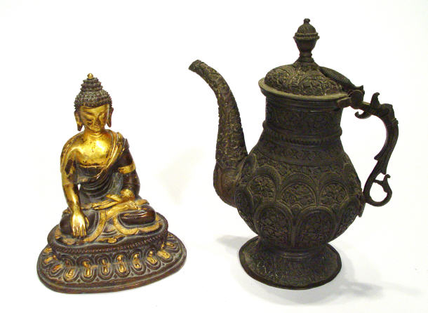 Appraisal: Tibetan gilded bronze Buddha in chased robes with floral design