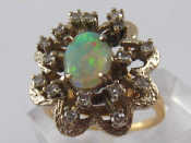 Appraisal: A yellow metal tests carat gold opal and diamond ring