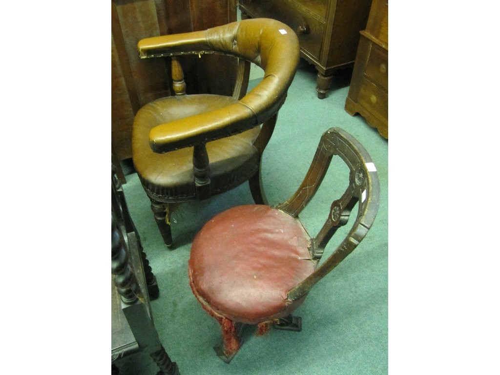 Appraisal: Lot comprising leather upholstered desk chair and a ship's chair