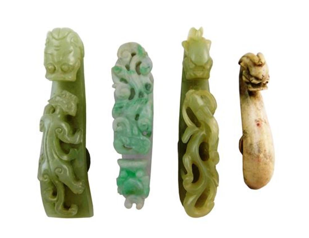 Appraisal: ASIAN Four carved stone belt hooks Chinese Qing dynasty including