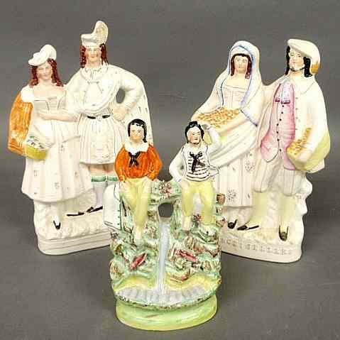 Appraisal: Four th c Staffordshire pieces- figural group Orange Sellers h