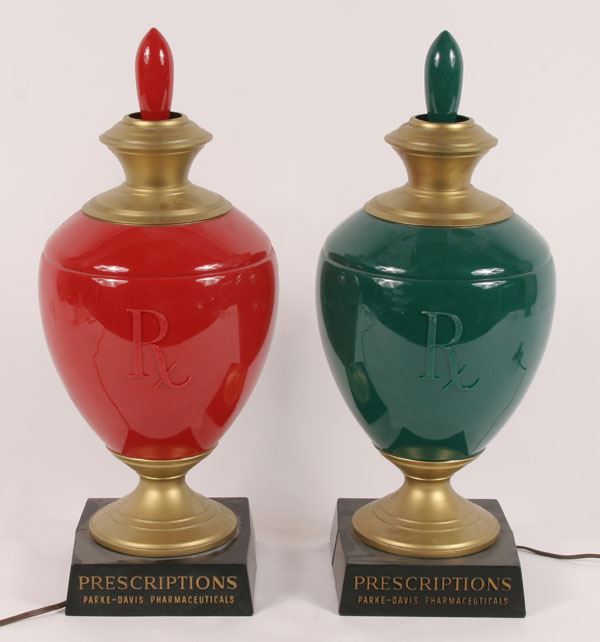 Appraisal: Pair Parke Davis pharmacy advertising lamps plastic pharmacy bottles urns