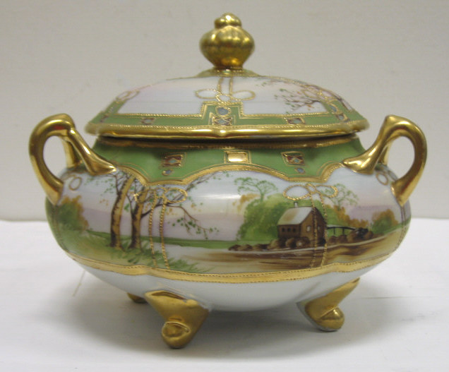 Appraisal: NIPPON PORCELAIN LIDDED COOKIE JAR Three-handled lobed squat body with