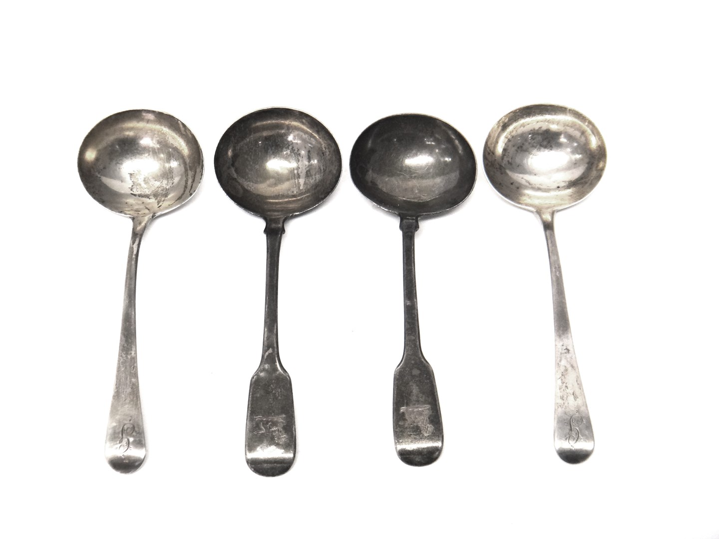 Appraisal: A pair of silver Old English pattern sauce ladles London