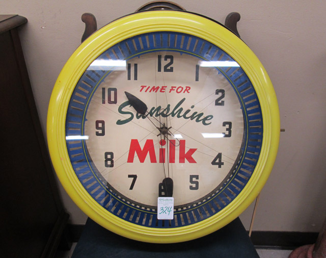 Appraisal: SUNSHINE MILK ADVERTISING CLOCK Time for Sunshine Milk round with