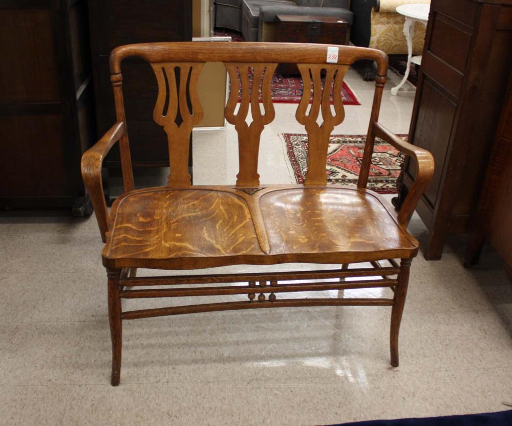 Appraisal: BENTWOOD OAK SETTEE American c having triple back splats over