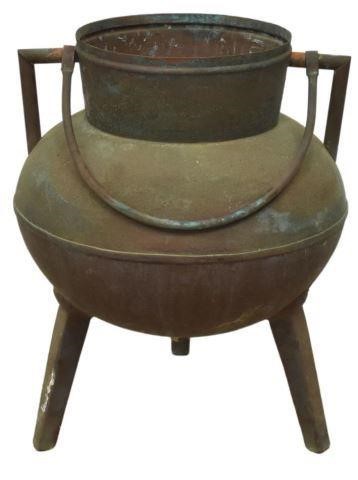 Appraisal: Large Continental handled copper cauldron rising on a tripod les