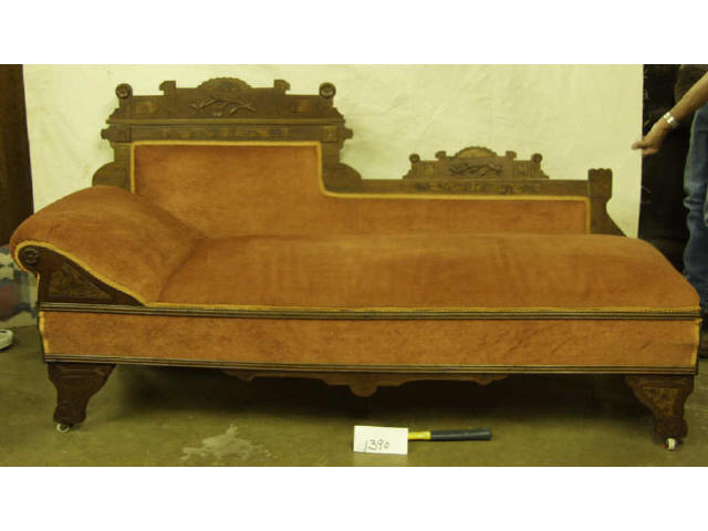 Appraisal: Walnut Eastlake style fainting couch on original porcelain castors measures