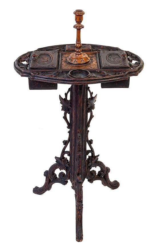 Appraisal: A Black Forest Carved Smoking Stand Height inches A Black