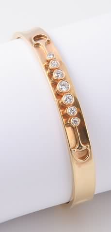 Appraisal: KY Hinged concave bangle X mm inner dimensions round diamonds