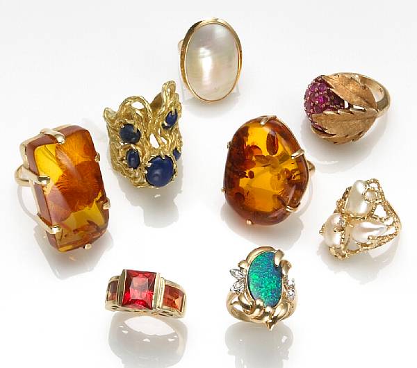 Appraisal: A collection of eight gem-set k and k gold rings