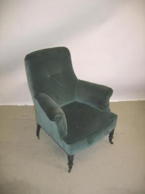 Appraisal: A PAIR OF VICTORIAN EBONISED ARM CHAIRS button upholstered in