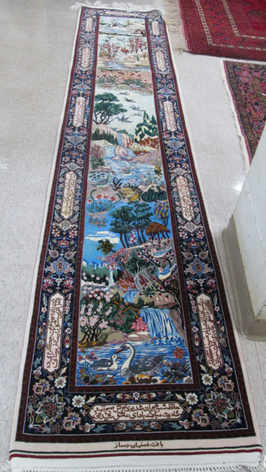 Appraisal: PERSIAN TABLEAU RUNNER a colorful multi-tiered pictorial landscape with trees