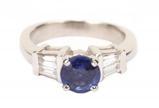 Appraisal: Platinum approximately ct round sapphire with baguettes set on shoulders