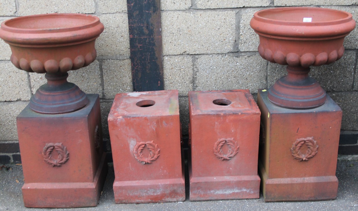 Appraisal: A pair of Neo Classical design redware stone urns each