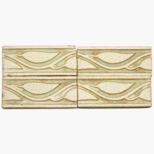 Appraisal: GRUEBY Fifty-six border tiles embossed with leaves and stems in