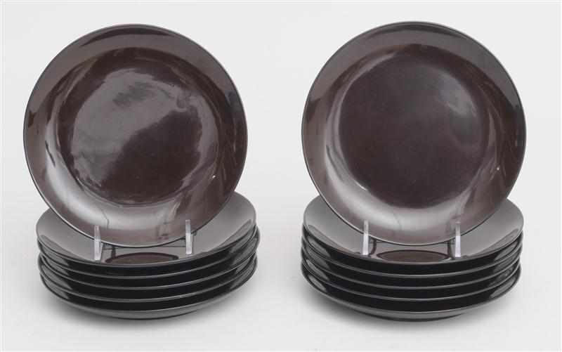 Appraisal: EILEEN GRAY - SET OF TWELVE BROWN LACQUER FOOTED PLATES