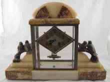 Appraisal: An Art Deco marble and onyx mantel clock with stylised