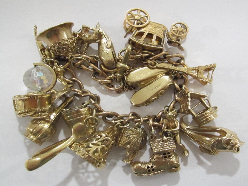 Appraisal: Nine carat gold charm bracelet with nineteen various ct gold