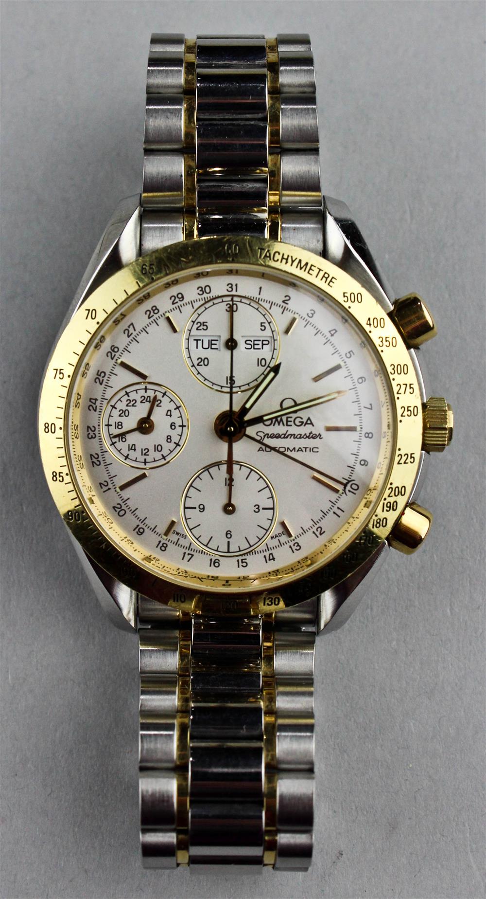 Appraisal: OMEGA STAINLESS STEEL AND GOLD SPEEDMASTER AUTOMATIC CHRONOGRAPH SERIAL NUMBER